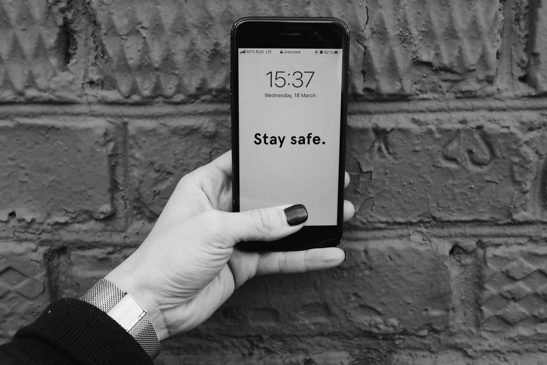Hand holding smartphone illustrating privacy dangers